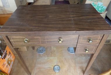 NICE SEWING TABLE AND LOTS OF NOTIONS