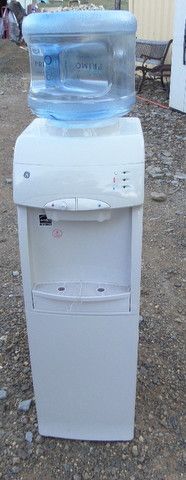 G E WATER COOLER WITH STORAGE COMPARTMENT BELOW