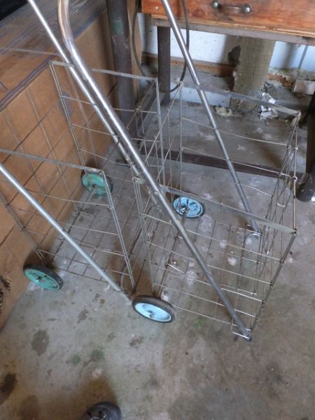 TWO HANDY FOLDING GROCERY CARTS.