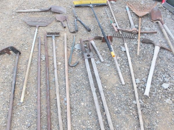 AT LEAST 25 HAND TOOLS SHOVELS, PRY BARS, CANVAS HOSE, HOLE SHOVEL, & OTHER HAND TOOLS