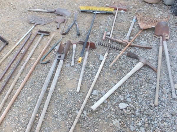 AT LEAST 25 HAND TOOLS SHOVELS, PRY BARS, CANVAS HOSE, HOLE SHOVEL, & OTHER HAND TOOLS