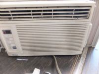 KENMORE WINDOW AC UNIT WITH REMOTE - POWERS ON AND COOLS