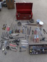 RED METAL TOOL BOX WITH LOTS OF TOOLS AND A JIG SAW