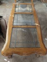OAK COFFEE TABLE WITH LEADED GLASS PANELS.