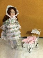 PRETTY  COLLECTIBLE  PORCELIAN/BISQUE DOLL WITH BABY IN PRAM