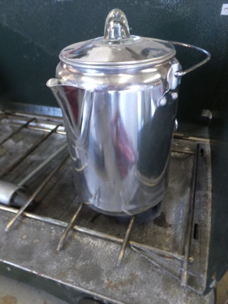 COLEMAN STOVE, CAMP COFFEE POT, BAR B QUE WIRE BASKET AND MIST MATES