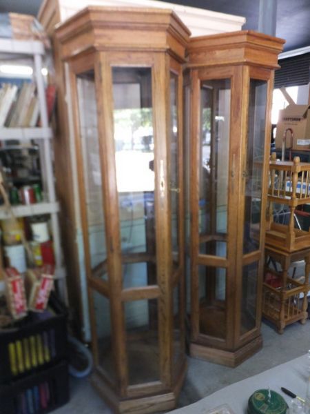 TWO HEX SHAPED OAK CURIO CABINETS WITH LIGHTS 