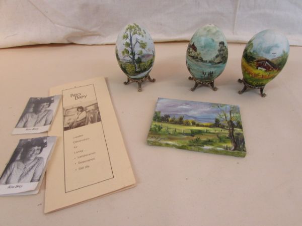 THREE HAND PAINTED GOOSE EGGS & A SMALL UNFRAMED PAINTING BY RITA BREY