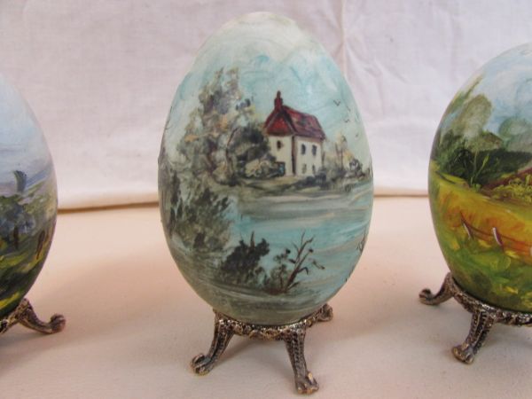 THREE HAND PAINTED GOOSE EGGS & A SMALL UNFRAMED PAINTING BY RITA BREY
