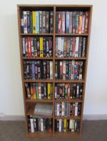CABINET WITH OVER 100 VHS MOVIES