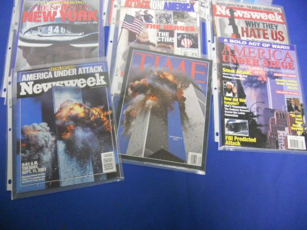 A COLLECTION OF 9/11 MEDIA IN PLASTIC COVERS