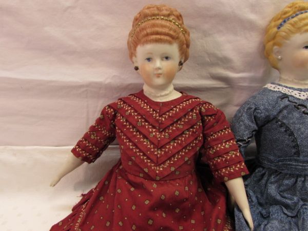 TWO PRETTY HAND PAINTED PORCELAIN DOLLS