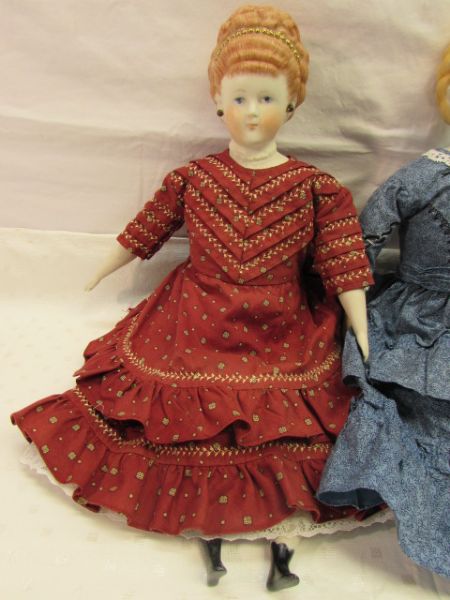 TWO PRETTY HAND PAINTED PORCELAIN DOLLS
