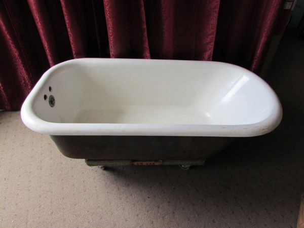 CLAW FOOT BATHTUB WITH VINTAGE FAUCETS