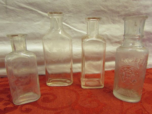 SIXTEEN ANTIQUE GLASS BOTTLES-GREEN GLASS GORDON'S DRY GIN, CREOMULSION, PAUL BUNYANS PINE, SUN PURPLE GLASS & MORE