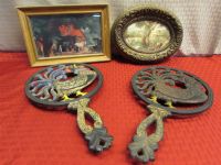 TWO VINTAGE CAST IRON ROOSTER TRIVETS & TWO WONDERFUL FRAMED PIECES  OF ART