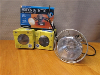NEW IN BOX MOTION DETECTOR LIGHT, HALOGEN LIGHT BULBS & PROTECTIVE CAGE
