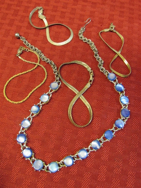 AN ARRAY OF BEAUTIFUL VINTAGE JEWELRY INCLUDING A STERLING SILVER BRACELET, PENDANTS, EARINGS & MORE!