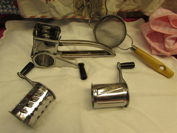VINTAGE KITCHEN! YELLOW DAZEY CAN OPENER, NEW TOWELS, APRONS, HAND HELD GRINDER, STAINLESS STEEL LADLES & MORE