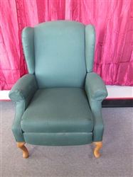 PUT YOUR FEET UP WHEN YOU RELAX IN THIS ELEGANT WINGBACK RECLINER