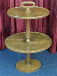 VINTAGE TWO TIER OVAL TABLE WITH HANDLE & LEAD FILLED BASE