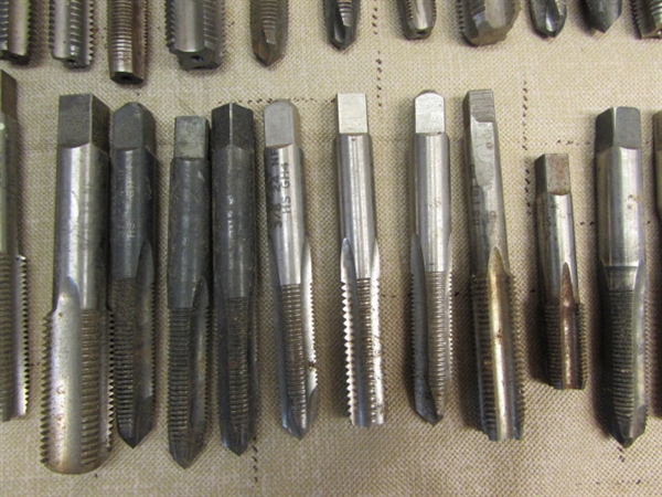 HUGE ASSORTMENT OF OVER 50 TAPS, PRIMARILY BESLY BRAND & A TAP WRENCH