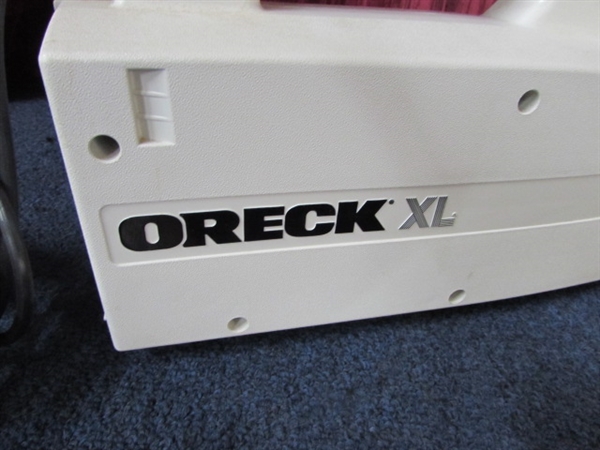 FOR QUICK CLEAN UPS THE ORECK XL COMPACT COMMERCIAL HAND HELD VACUUM WITH ATTACHMENT & BAGS