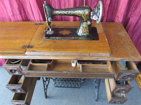 ANTIQUE SINGER REDEYE SEWING MACHINE IN TREADLE WITH OAK CABINET - 7 DRAWERS