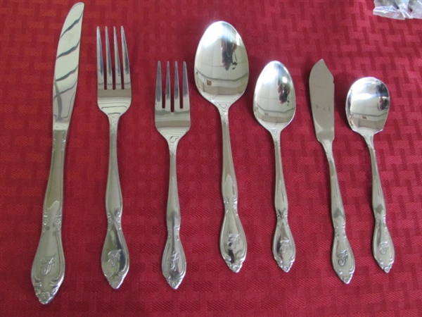NEW!  EIGHT PLACE SETTINGS OF ELEGANT STAINLESS STEEL FLATWARE