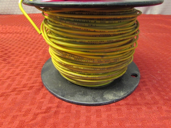 APPROX. 3/4 FULL SPOOL OF 14 GA SOLID COPPER WIRE YELLOW