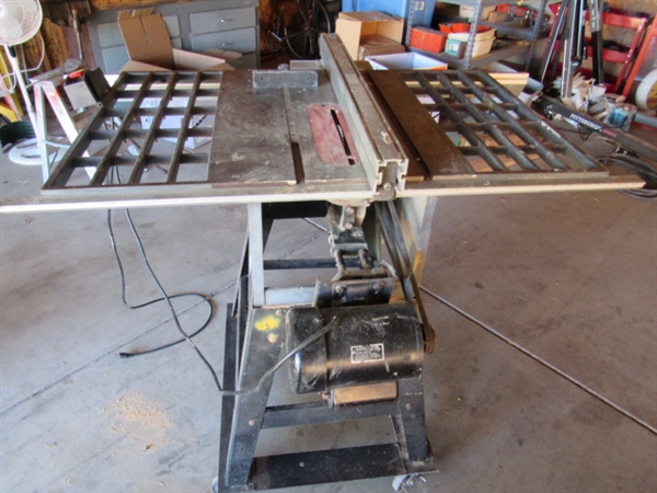 TEN INCH INDUSTRIAL TABLE SAW ON METAL STAND WITH EASY ROLL CASTER WHEELS