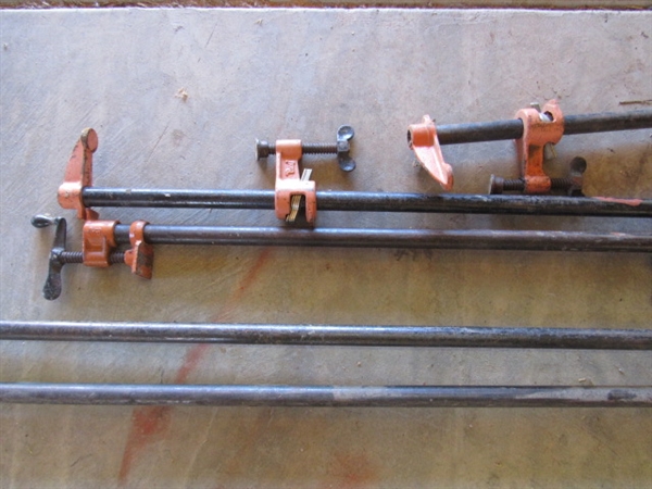 SIX LONG PIPE CLAMPS