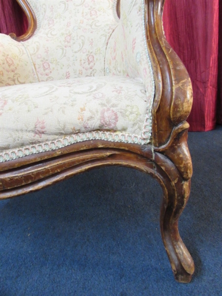 ANTIQUE UPHOLSTERED WINGBACK CHAIR WITH CARVED MAHOGANY LEGS & FRAME