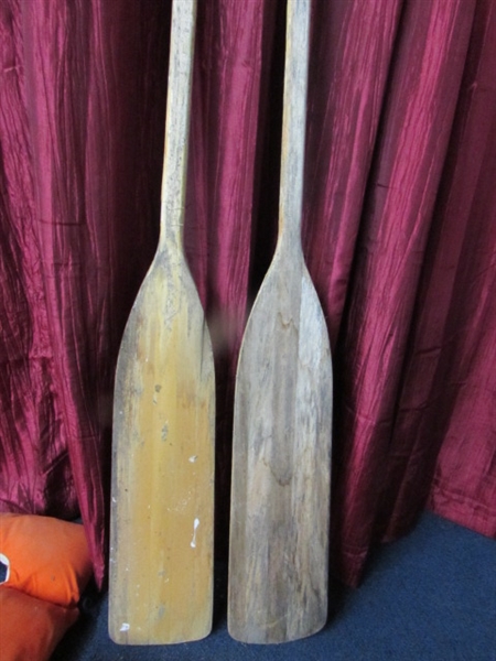 TWO VINTAGE INDIAN HEAD WOODEN OARS & THREE ORANGE CANVAS LIFE VESTS