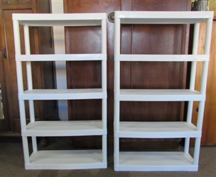 A PAIR OF WHITE PLASTIC SHELVING UNITS TO KEEP YOUR STUFF TIDY