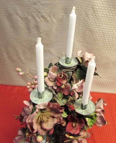 3 CANDLE CENTERPIECE TASTEFULLY DECORATED WITH MAUVE FLOWERS AND GRAPES