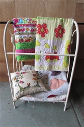 METAL QUILT RACK WITH VINTAGE QUILTS AND A NEEDLEPOINT PILLOW