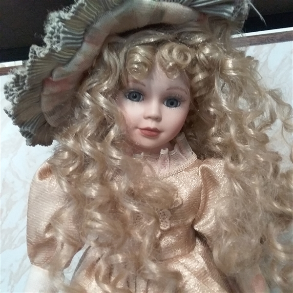 17 PORCELAIN DOLL WITH STAND