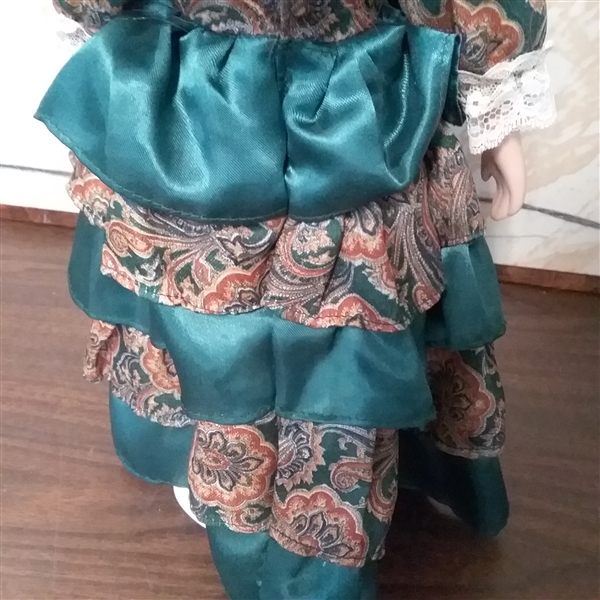 17 PORCELAIN DOLL WITH STAND