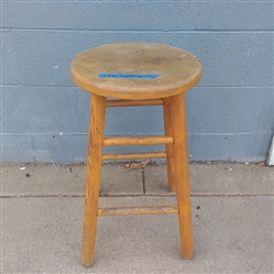 A SMALL WOOD STOOL