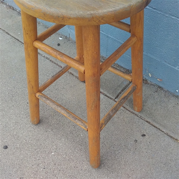 A SMALL WOOD STOOL