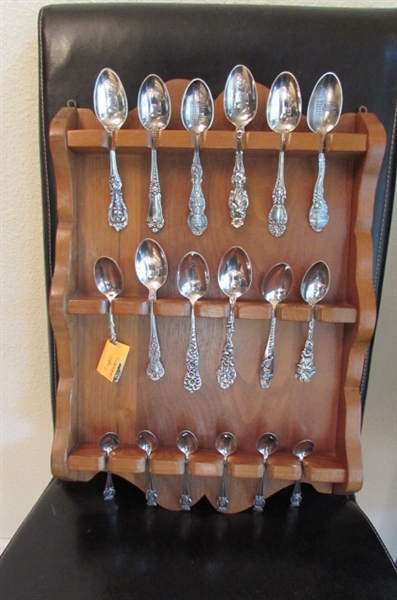 COLLECTION OF STERLING SILVER & SILVER PLATE SOUVENIR SPOONS WITH 18 SLOT WOODEN DISPLAY