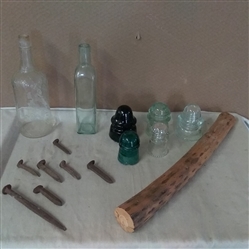 VINTAGE GLASS INSULATORS, BOTTLES, SPIKES AND A RAIN STICK