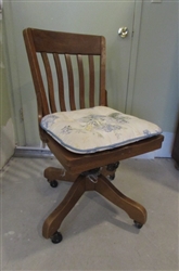 VINTAGE WOOD OFFICE CHAIR ON WHEELS WITH PADDED FLORAL CUSHION