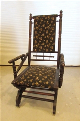 ANTIQUE WOODEN ROCKING CHAIR WITH FLORAL FABRIC PADDED SEAT AND BACK