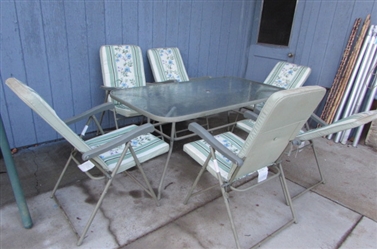 OUTDOOR TABLE AND 6 MATCHING CHAIRS