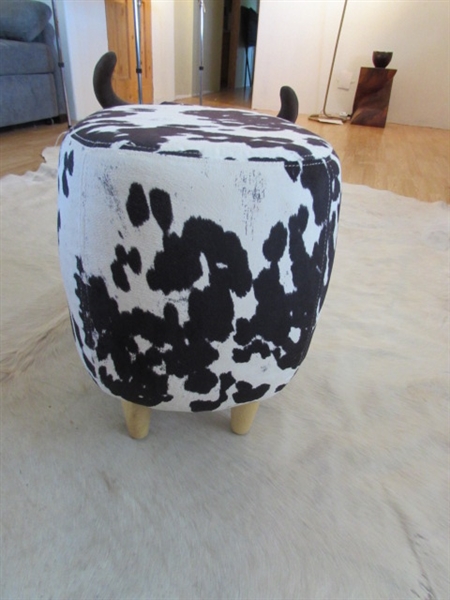 LARGE WHITE ANIMAL HIDE AND LITTLE COW FOOTSTOOL.