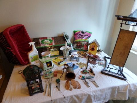 OVERSTUFFED BASKET FULL OF GARDENING SUPPLIES, FOLDING MINI BENCH, WIND CHIMES, BIRD HOUSE, POT LIFTERS