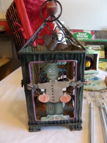 OVERSTUFFED BASKET FULL OF GARDENING SUPPLIES, FOLDING MINI BENCH, WIND CHIMES, BIRD HOUSE, POT LIFTERS