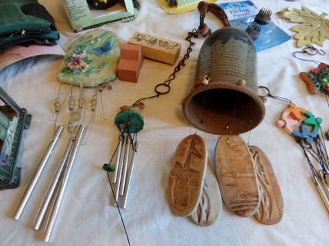 OVERSTUFFED BASKET FULL OF GARDENING SUPPLIES, FOLDING MINI BENCH, WIND CHIMES, BIRD HOUSE, POT LIFTERS